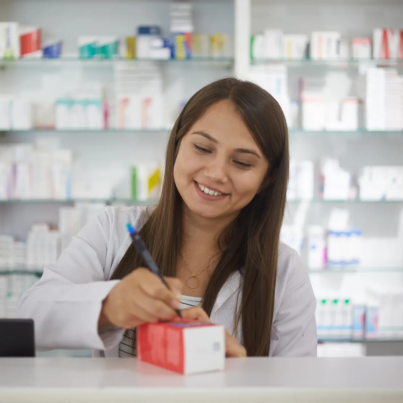 Pharmacist signing off medication